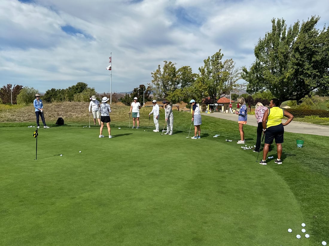 Susie Myers giving pointers on putting