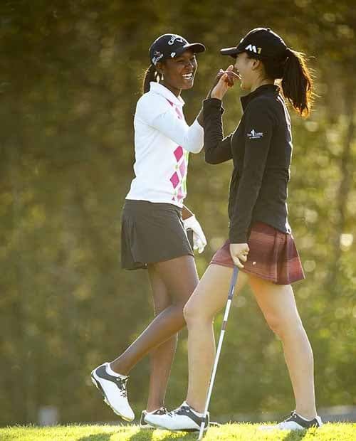 two young girls golfing-1